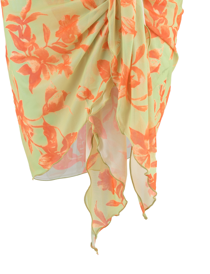A sheer light green sarong with orange floral prints and an asymmetrical hem, draped at the waist—perfect to pair with the TIGERMIST AVE 2PC BIKINI BOTTOM - POP FLORAL.