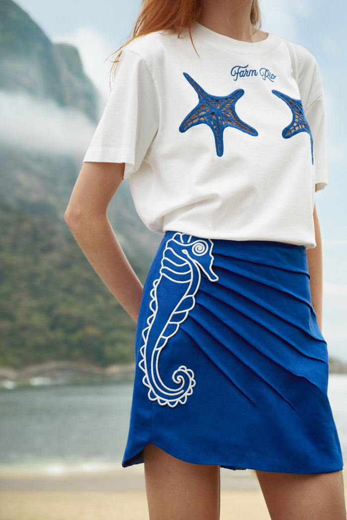 FARM Rio model wearing the Blue Seahorse Embroidery Euroflax Premium Linen Mini Skirt