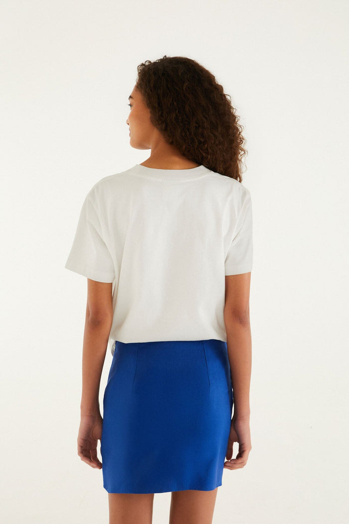 FARM Rio model wearing the Blue Seahorse Embroidery Euroflax Premium Linen Mini Skirt