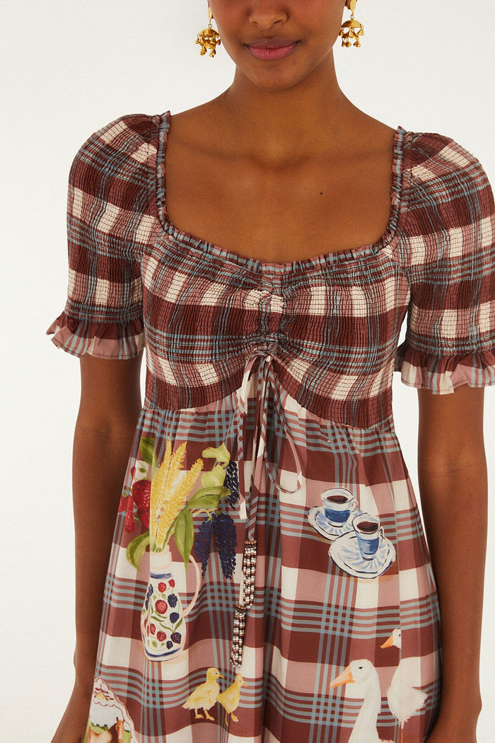 FARM Rio model wearing the Brown Country Table Tartan Smocked Maxi Dress