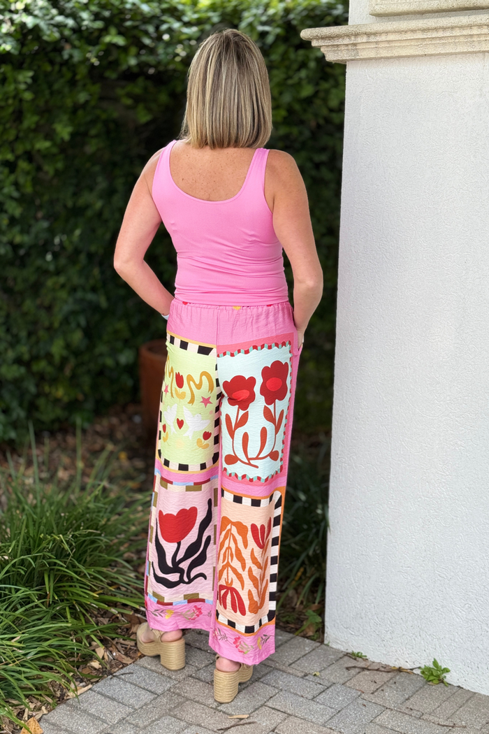 Handmade Italian pants with bold cherry and floral print design