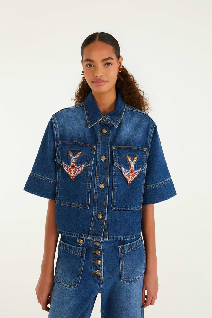 FARM Rio model wearing the Denim Porcelain Birds Embroidered Shirt