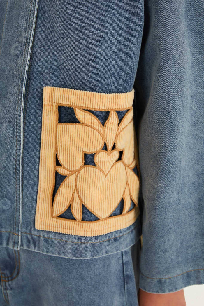 FARM Rio model wearing the Denim Richelieu Barn Jacket